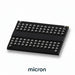 Black electronic component with silver pins on a white background