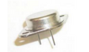 A small round metallic object with a flat top and two short prongs, photographed on a plain white background.
