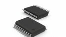 Two black integrated circuits with silver pins on a white background