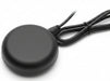 Black round wireless charging pad with a cable on a white background