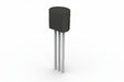 Black electronic component with three metallic legs on a white background