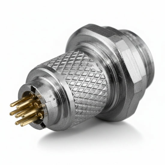 A small metallic cylindrical connector with a knurled textured body and several gold-toned pins visible on one end, shown on a plain white background.
