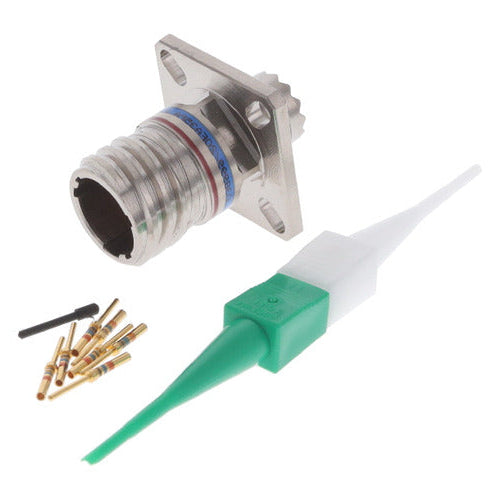 An RF connector tool kit featuring a silver metal RF connector, a green and white plastic probe, and several small gold and black radial resistors, displayed on a clean white background.