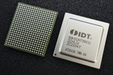 An IDT microprocessor chip shown from both sides: the bare side with a green border and dense array of gold solder balls on the left, and the packaged side with a silver metal top cover on the right, displayed on a dark textured background.