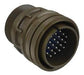 Brown cylindrical connector with multiple ports on a black background