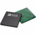 Two electronic integrated circuit chips, one with a black top surface and white printed text/logo, and the other showing a green solder-side face with gold-plated pads, on a white background.