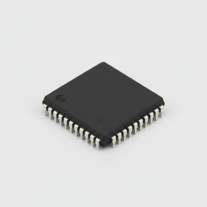 A square black electronic integrated circuit chip with a small metallic pin on one corner, shown on a plain white background.