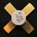 BLX39 Gold-colored mechanical component with a white label on a black background