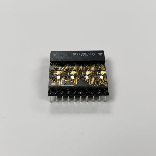 DL1416T Electronic component with gold and black design on a gray background