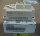 A large white industrial power electronic module with printed text including 'eupec' and 'FC400R12KS4', resting on top of a brown cardboard box with a white shipping label.