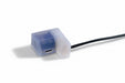 Small electronic component with blue light on a white background