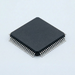 Electronic chip with metallic pins on a light gray background