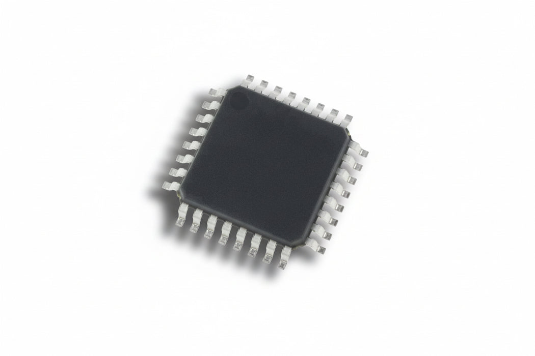 Small electronic chip with metallic legs on a white background