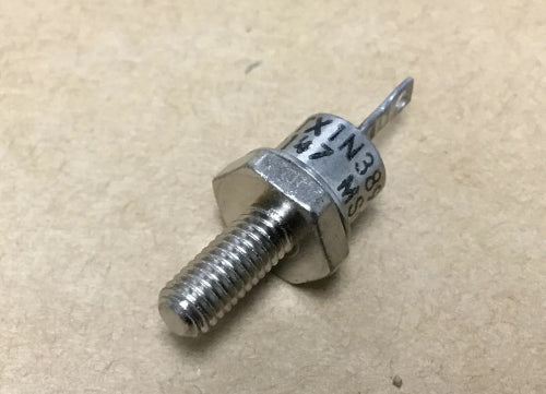 Metal screw with a hex head on a beige background