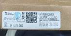 A close-up of a brown cardboard box with a white printed label from Texas Instruments showing product details, a QR code, and barcodes.