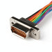 Close-up of a metallic connector with a rainbow-colored cable