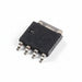 A small black electronic integrated circuit component with several silver metal pins, shown on a plain white background.